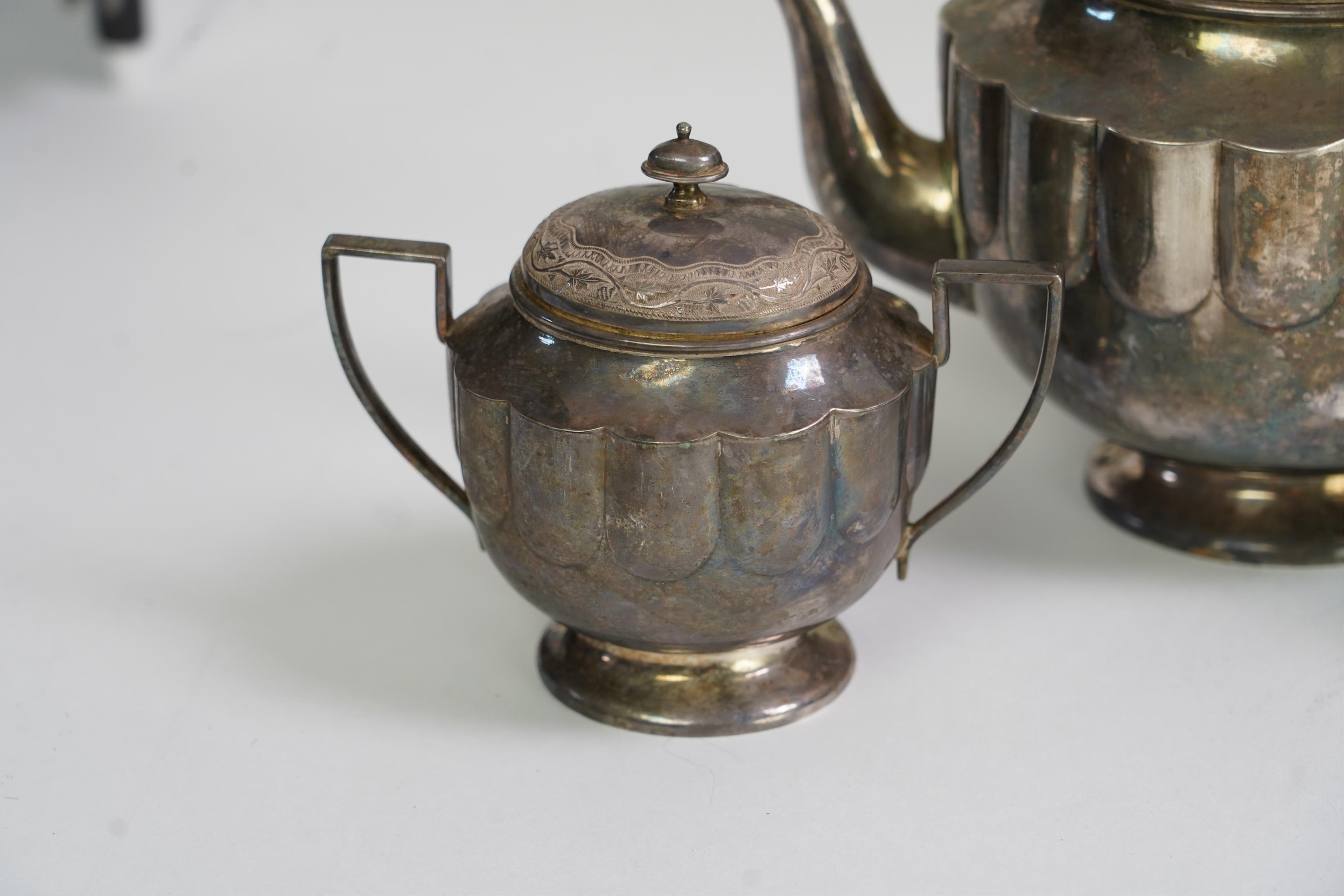 An early 20th century Indian white metal (tests as silver) three piece tea set